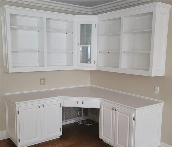 Photo is showing the same cabinets but white and restored.