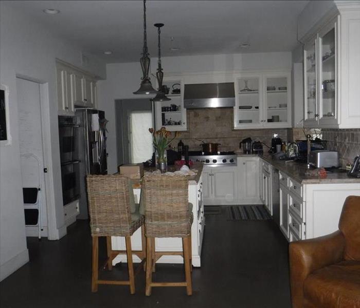 Photo is showing a kitchen that was affected by smoke from a nearby fire